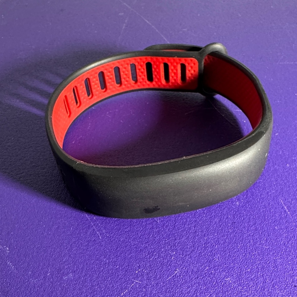 Under Armour htc Activity Tracker wrist band. Black and red, untested.